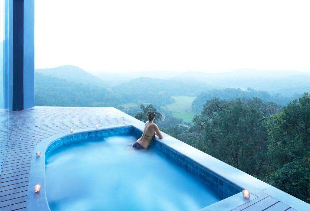 taj swimming pool, spectacular view of coorg hills,